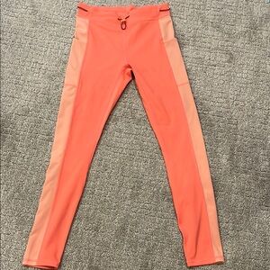 Orange/coral Fabletics Athletic Leggings with Two-Tone Panels